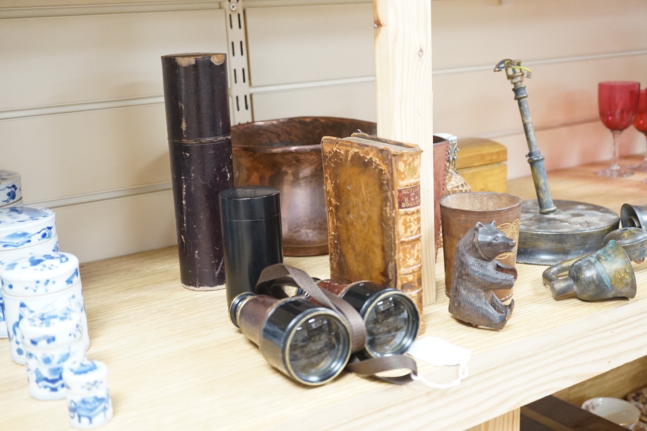 A quantity of collectables including a pair of Dolland of London binoculars, a Black Forest bear carving, a copper jardiniere, an olive wood jewellery box etc.